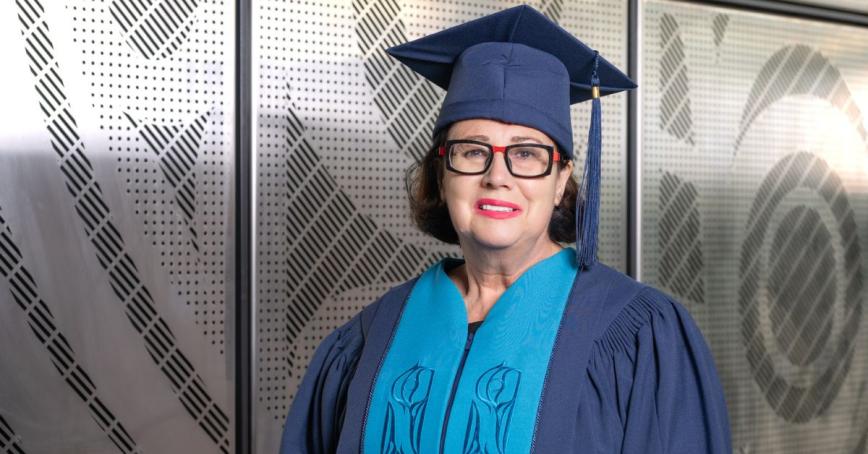 The Honourable Janet Austin smiling outside of the Dogwood Auditorium