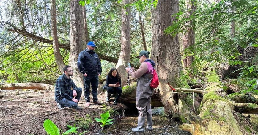 Students gather in the forest as part of their outdoor learning experience at Royal Roads University 