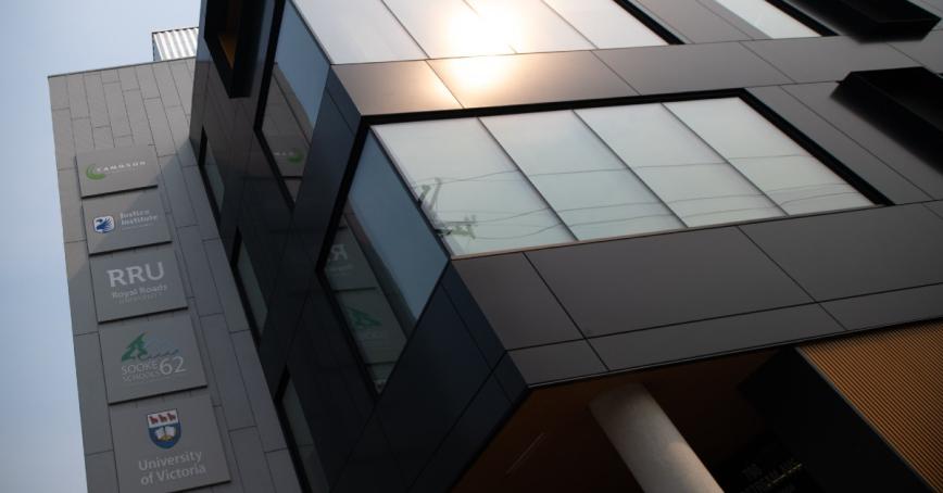Collaborative campus building at RRU Langford, John Horgan campus showing partner logos and floor to ceiling windows.