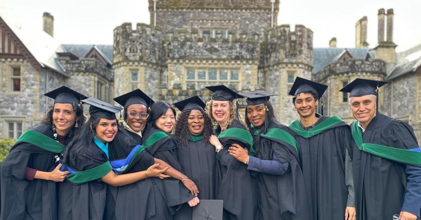 Graduates pose in front of Hatley Castle
