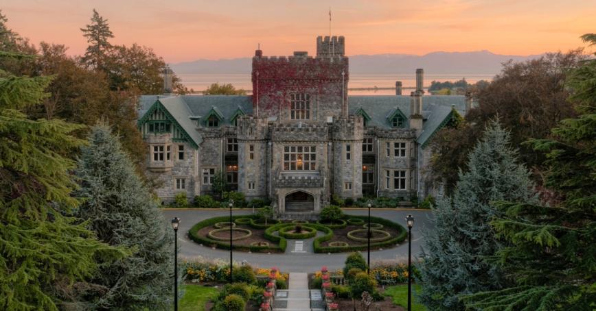 Hatley Castle with a sunrise in the background