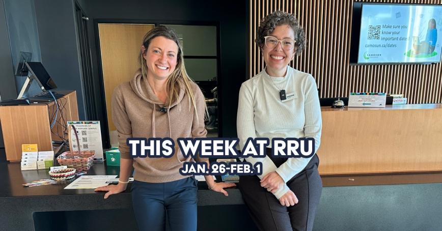 Two women standing in front of connection desk