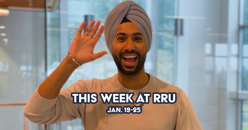 Man wearing a turban waving and smiling