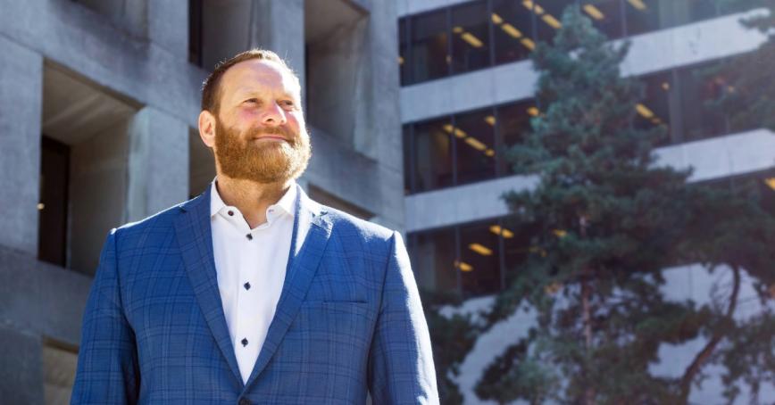 Trevor Koot standing outside an office building