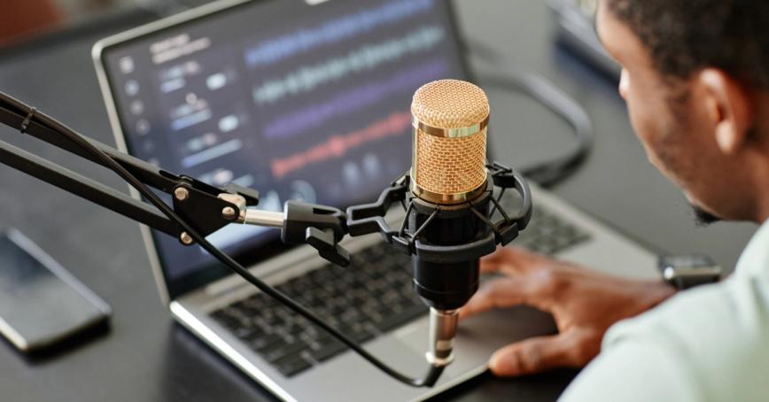 High angle close up of African-American man recording podcast 