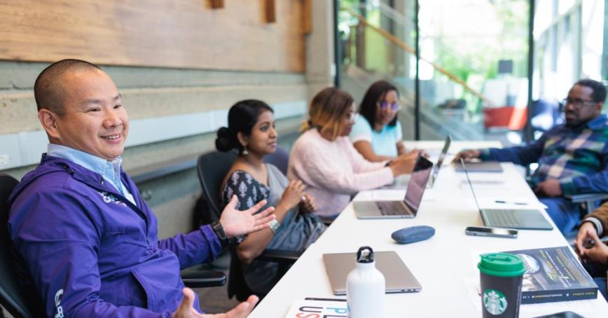 People around a table having a discussion