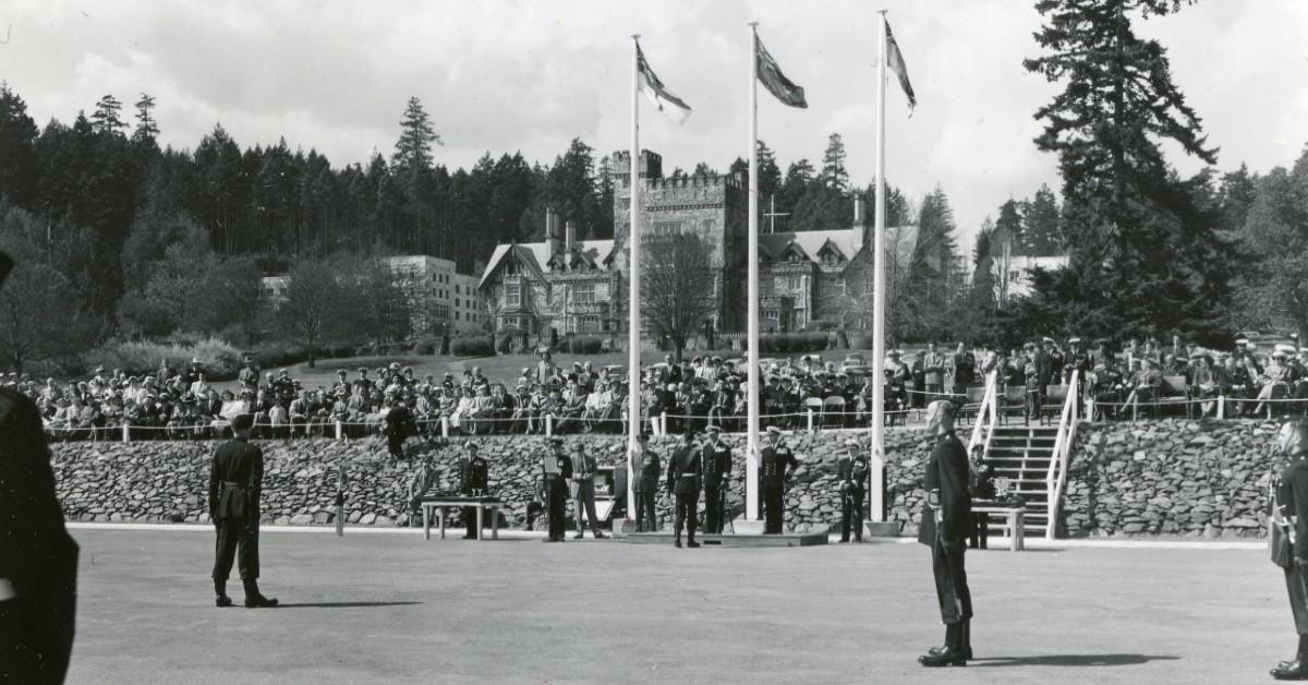 A historic photo of cadets standing on campus grounds