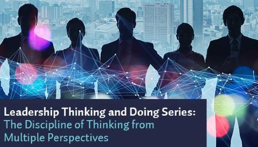 picture of 5 people in shadow with a city landscape behind them.