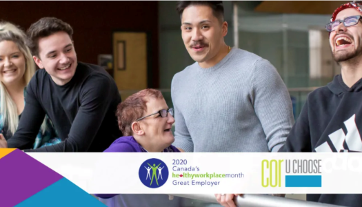 5 people gathered around all seeming to be enjoying themselves.