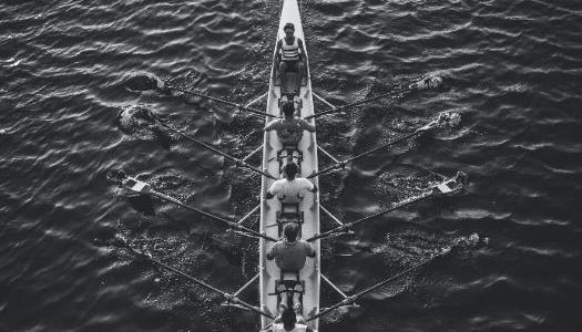 A boat with rowers in it.