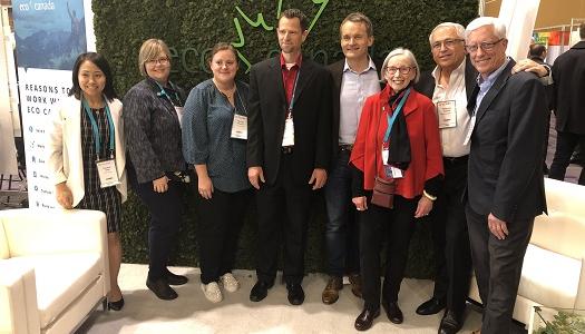 Group-of-people-at-Globe-Forum-standing-in-front-of-broccoli-wall