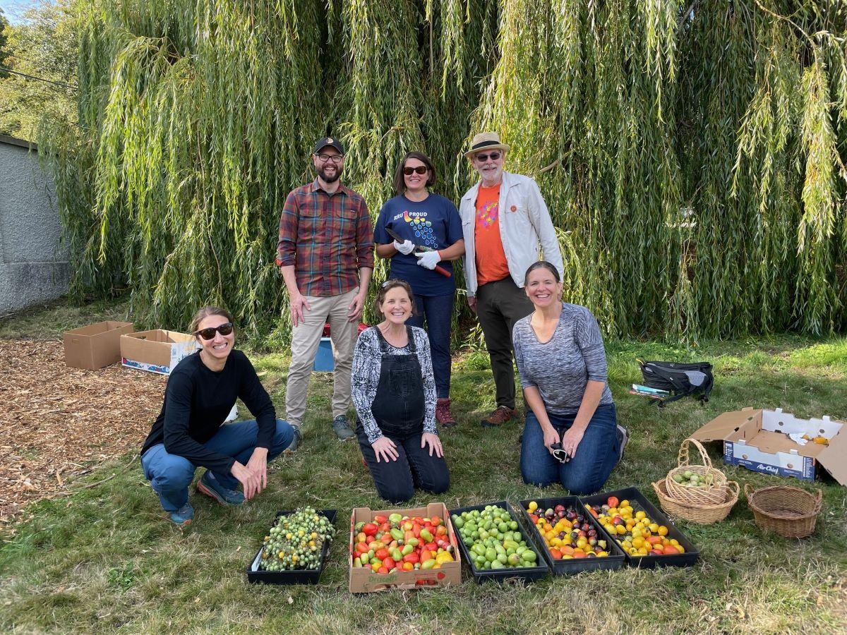 School of Leadership Studies Staff in RRU Giving Garden with bounty of tomatoes