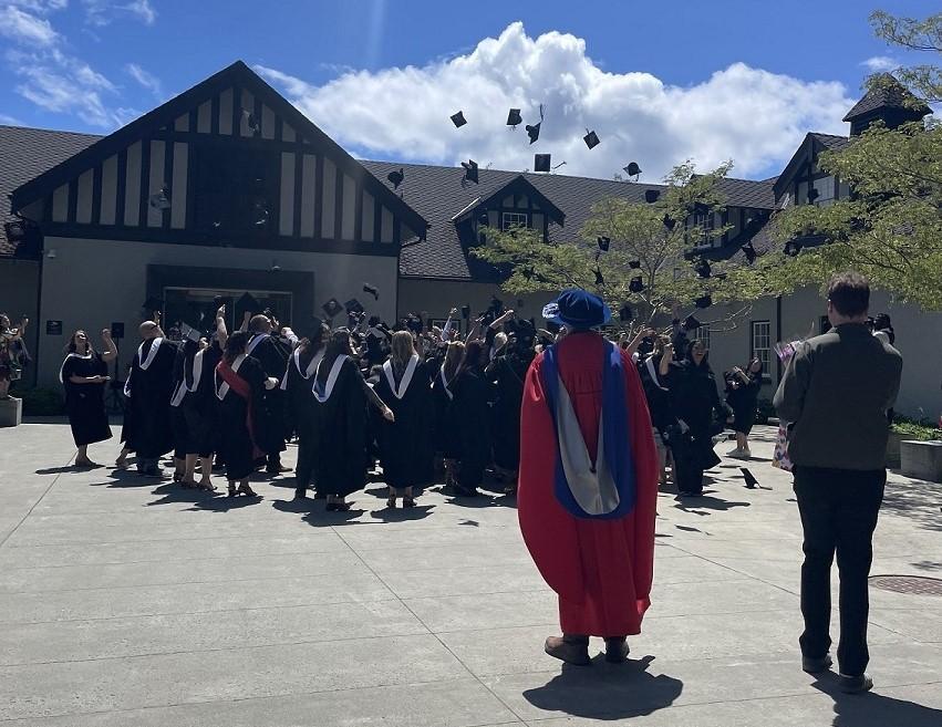 graduates throwing hats