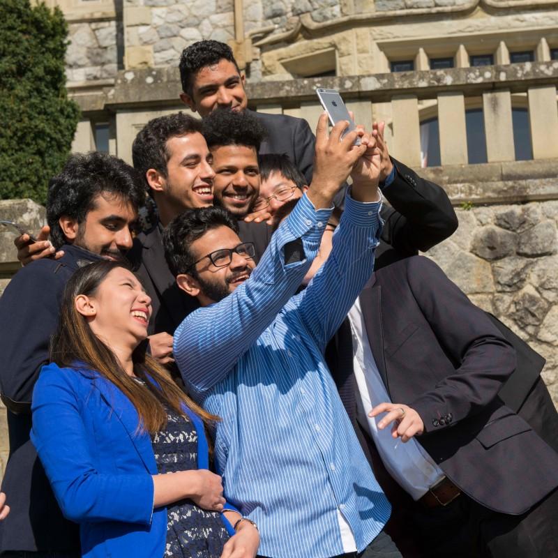 Group-of-students-outside-Hatley-Castle-taking-photo