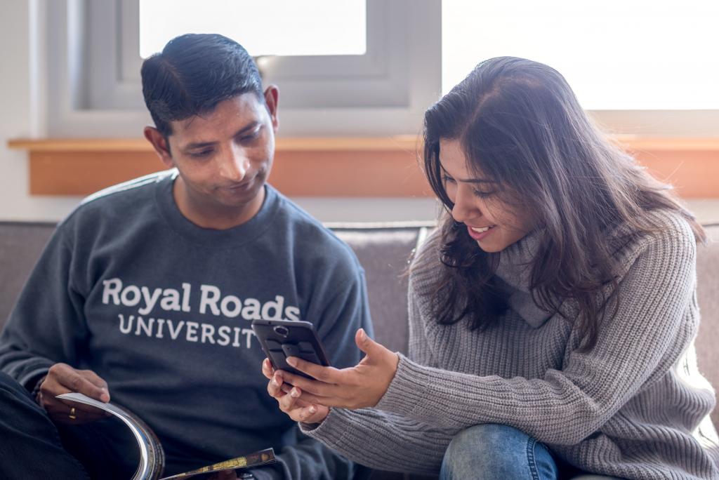 Two-students-looking-at-cellphone