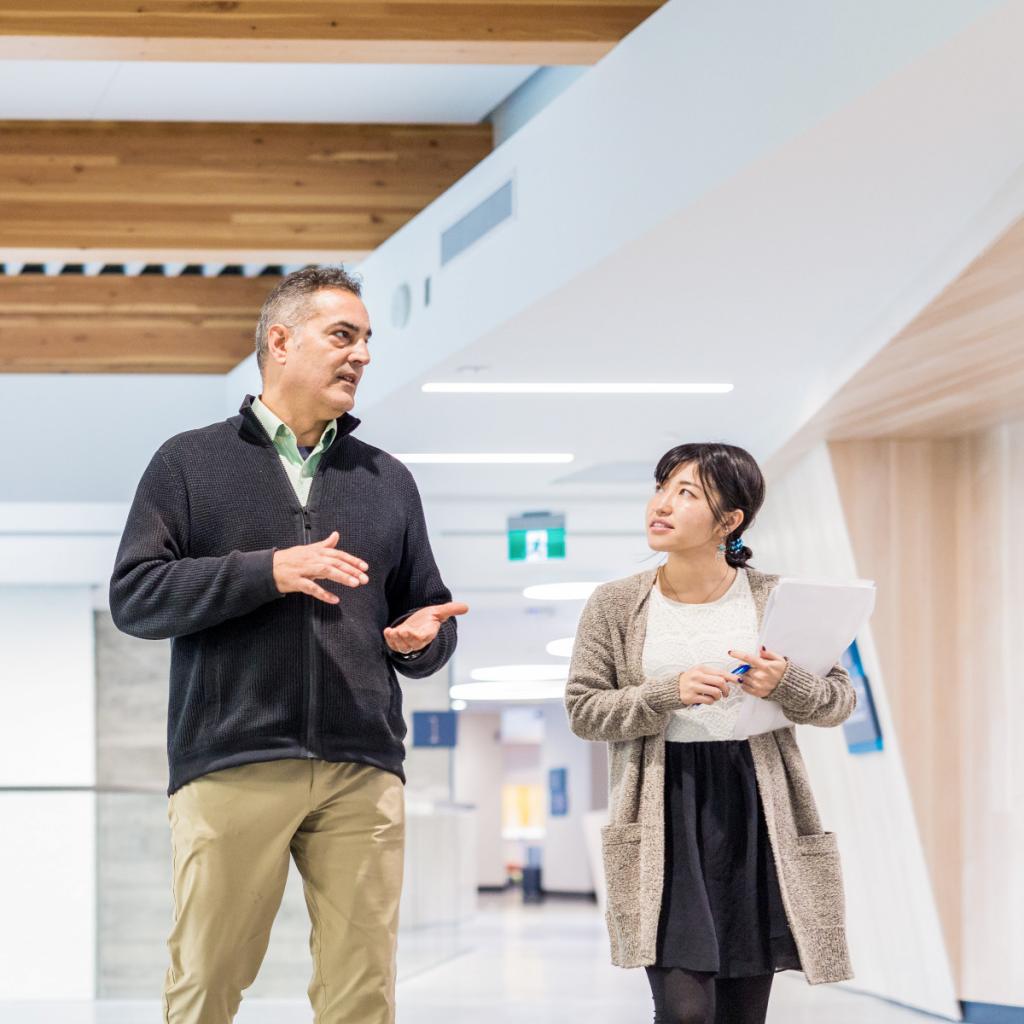 Instructor and student in conversation