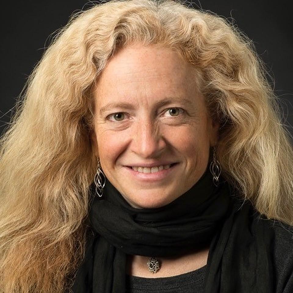 Julia Szucs smiling and looking directly into camera.