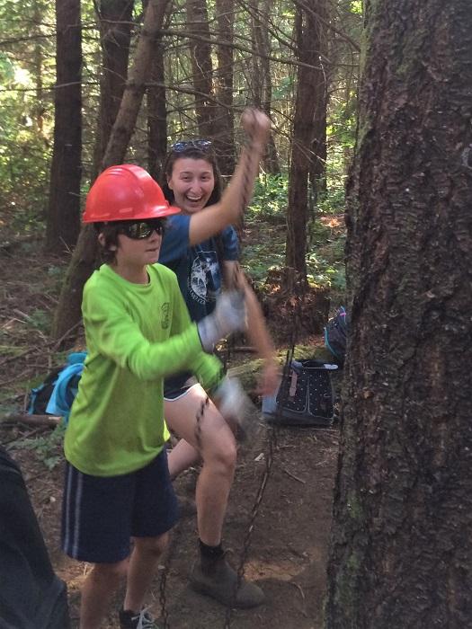 Educator-with-student-and-ropes-climbing-tree