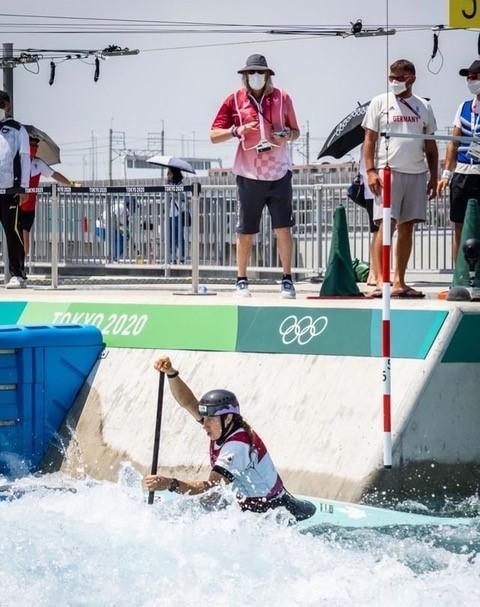Haley Daniels, in her canoe, is watched on the sidelines by her dad, Kimberley (she/her), the first first openly transgender official at an Olympics. Photo: Dave Holland
