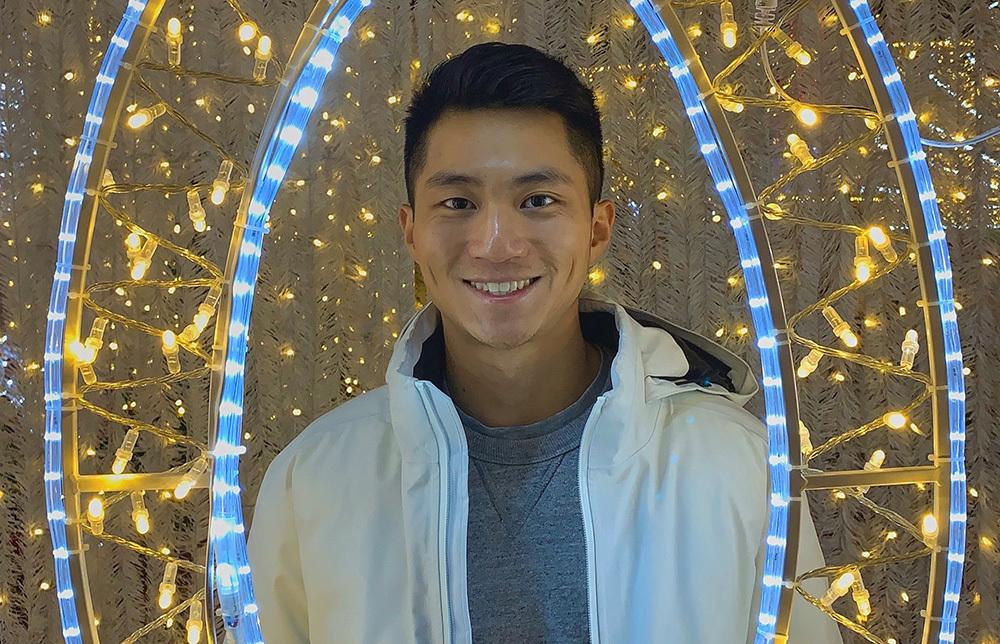 Chis Tang surrounded by lights 