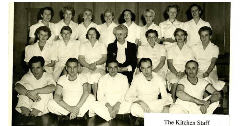Black and white picture of kitchen staff 1943, in the Grant Building, Quarter Deck. Eileen Maurice is in the middle row, third from the right.