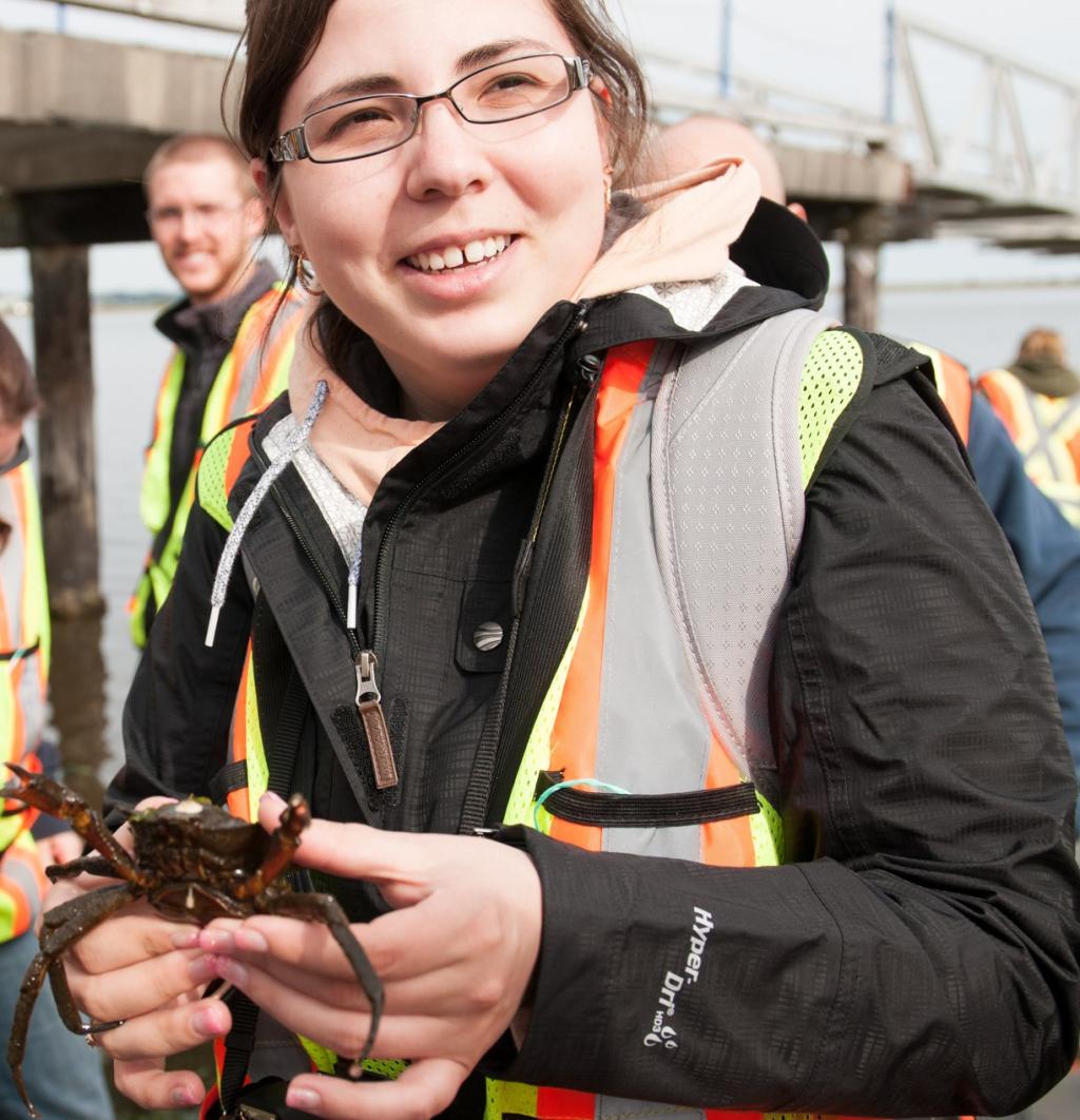 environment student holding a crab
