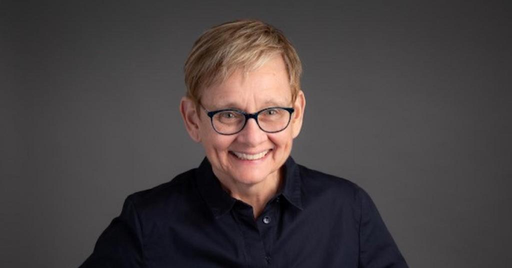 Head shot of Nancy Poole smiling.