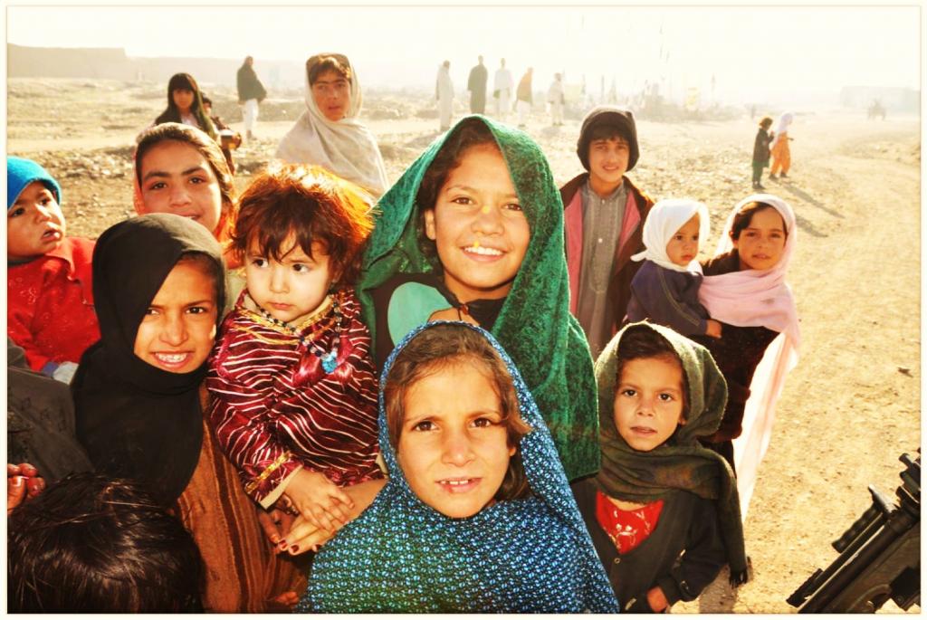 Photo of Afghanistani Girls; Children of different ages smiling at a camera