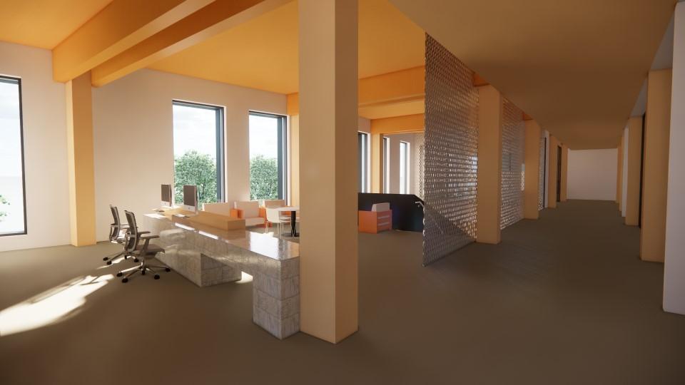 A marble reception desk and waiting area with big windows and view of trees.