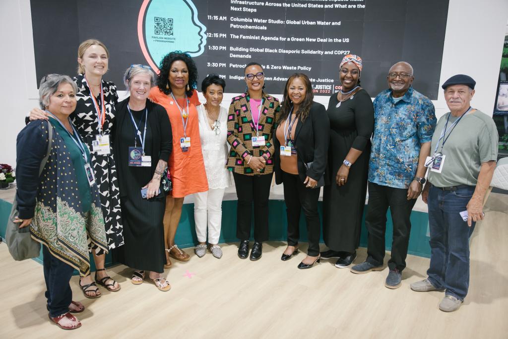 Deb Morrison stands with a group of international leaders at the Climate Justice Pavilion