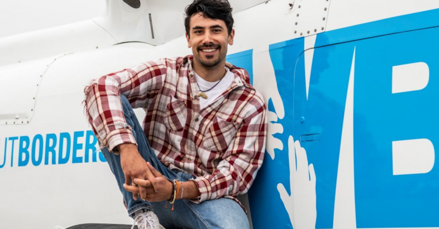 Owen posing on helicopter