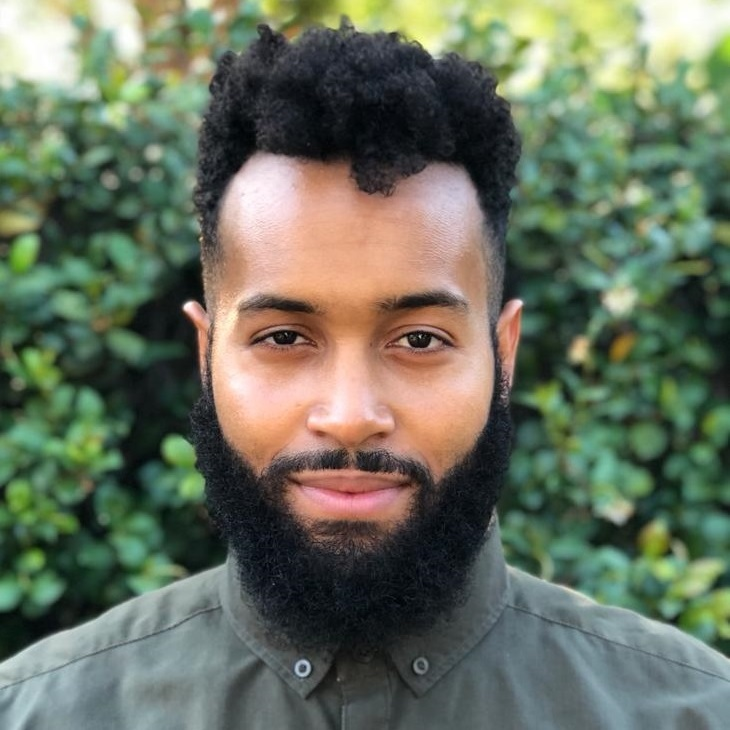 A man poses for a head shot.