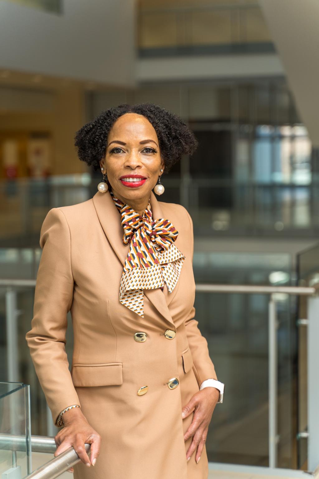 Andrea Davis standing in a modern looking building