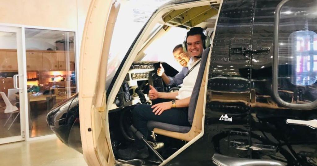 Ricadro Ramirez poses in a helicopter while on an internship