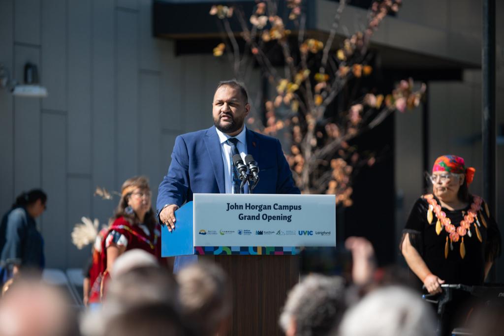 Ravi Parmar speaks at the podium