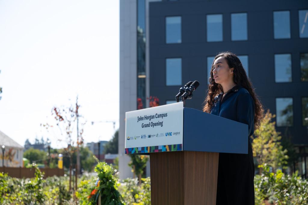 Student Angela Macasaquit speaks at the podium during the event.