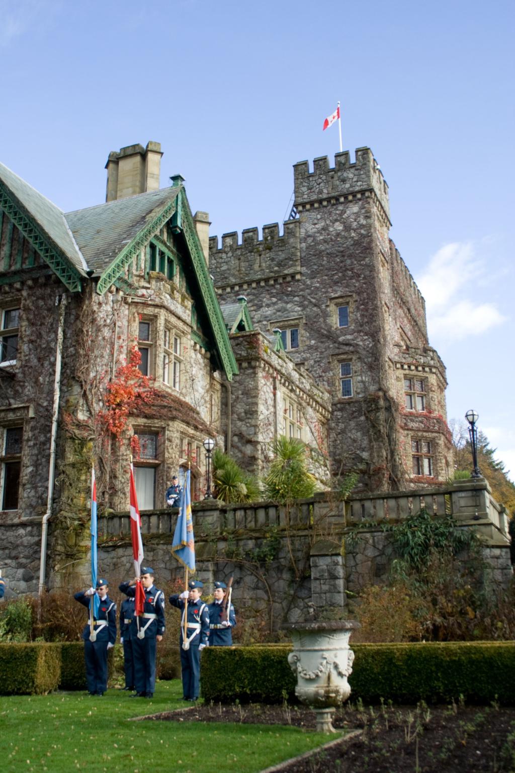 An image of a Remembrance Day ceremony taking place in front of national historic site, Hatley Castle. 