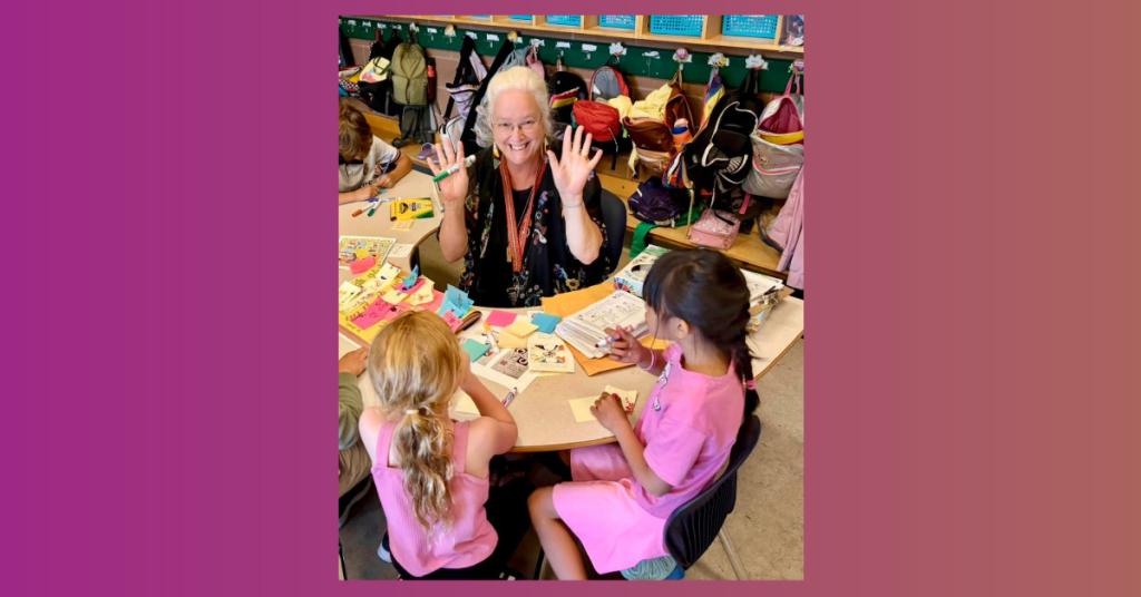 Shelley Jones chatting with elementary age students