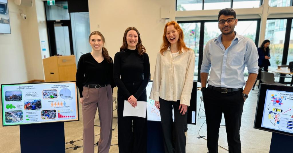 Four BBA students presenting at the RRU John Horgan Campus