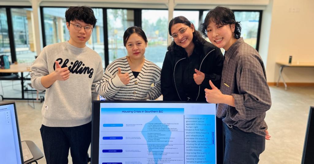 Four BBA students presenting at the RRU John Horgan Campus