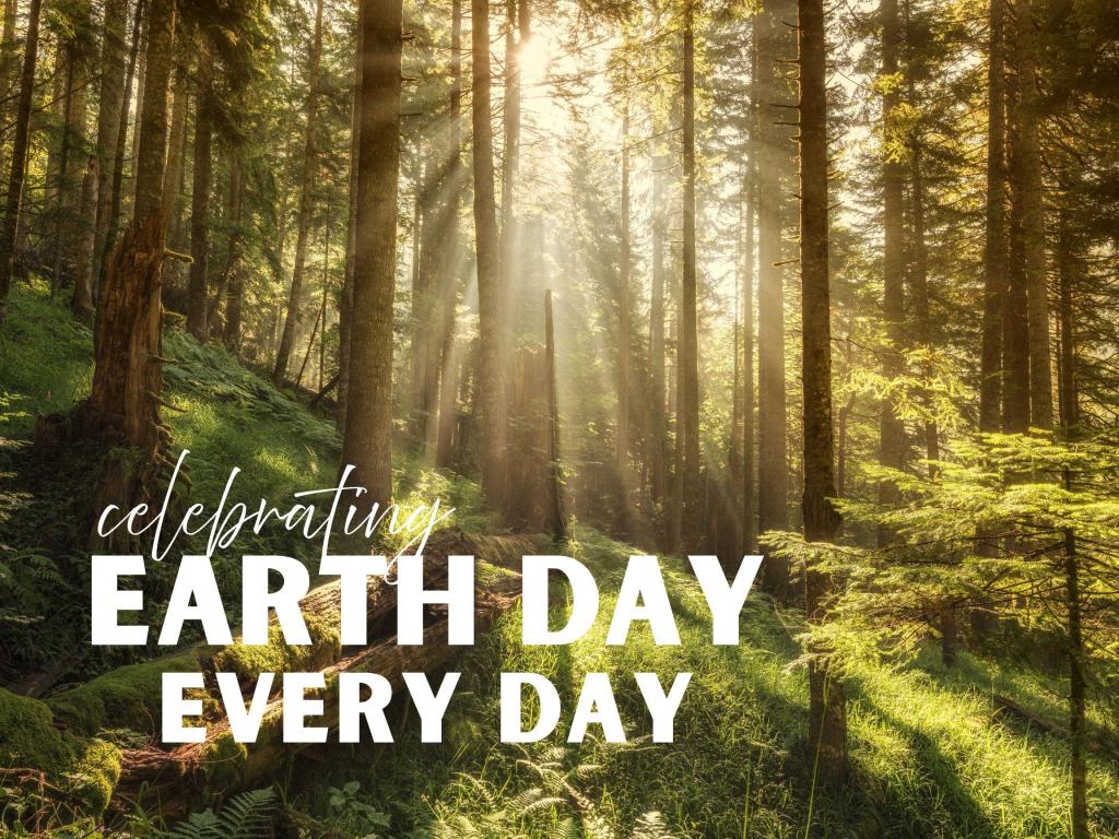 Earth month poster with image of forest under text