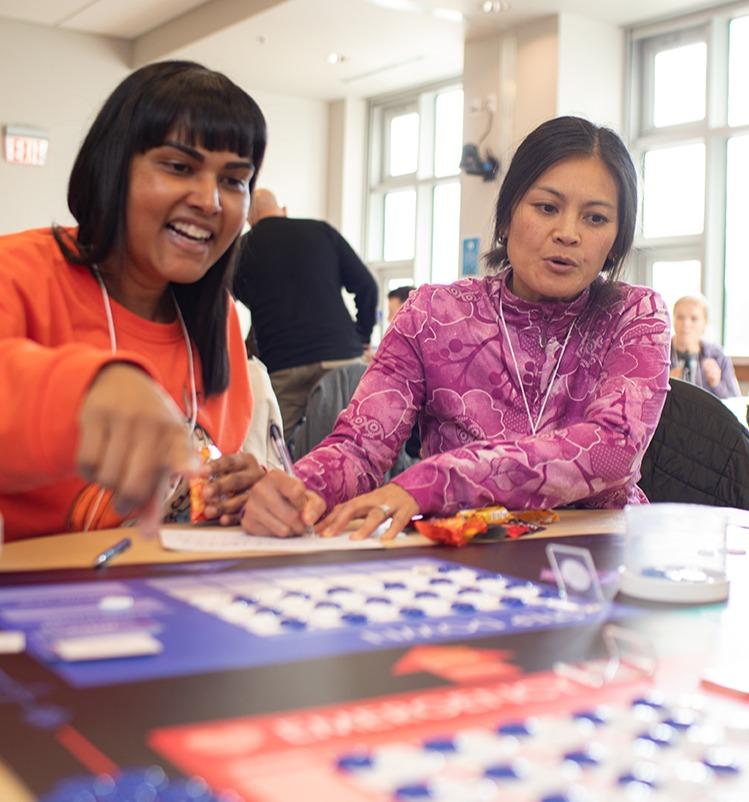 Two students at a table doing an assignment