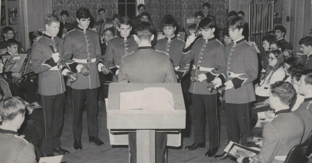 Chris Hadfield leads a group of young RRMC cadets in a handbell song