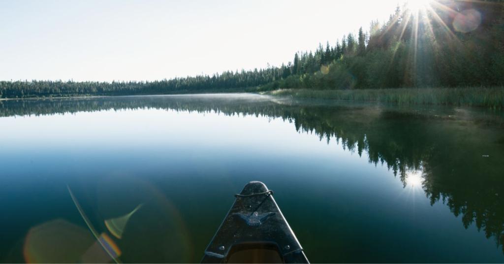 A bow of a canoe on the lake.
