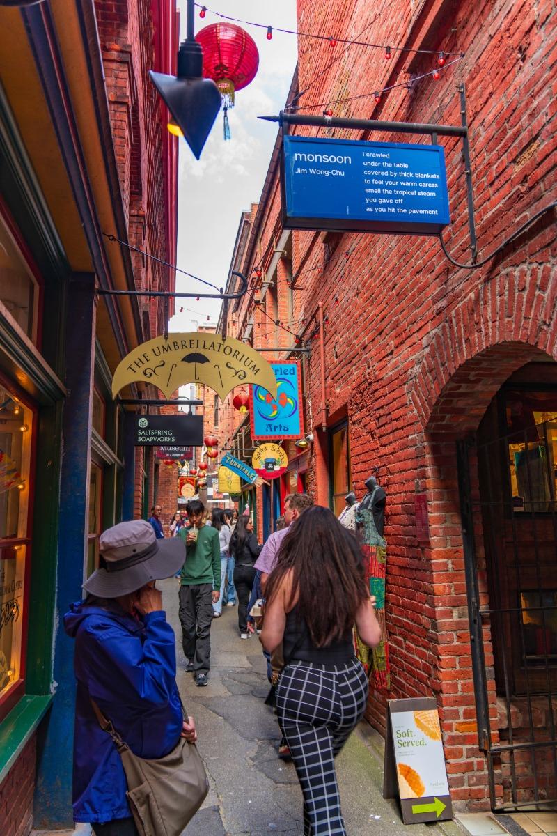 People walk through Fan Tan alley in Chinatown