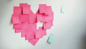 Heart made out of pink post-it-notes.
