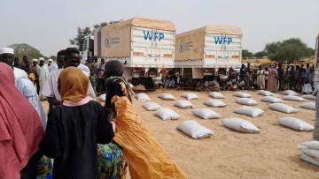 WFP trucks in Sudan delivering food as fighting plunges millions into hunger