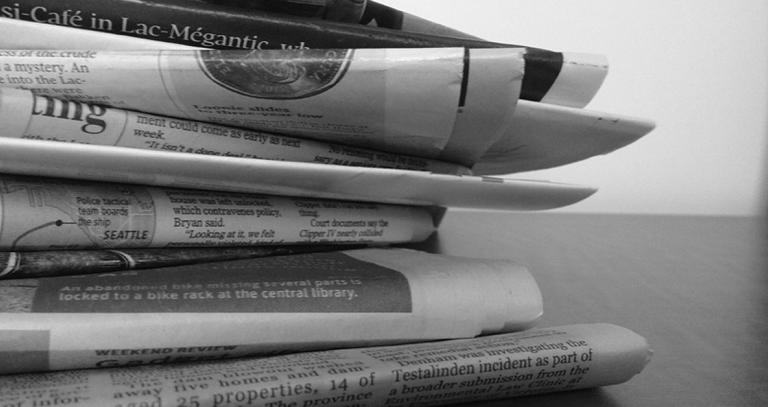 Stack of folded newspapers