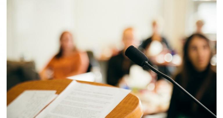 podium-with-notes-and-microphone