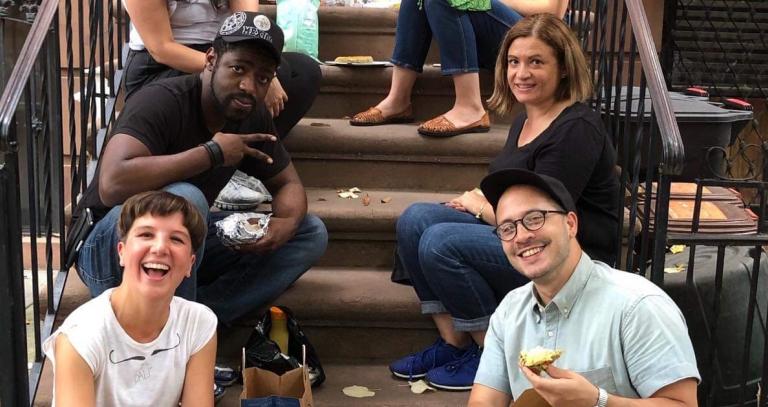 Group of students posing on a staircase for a photo. Photo courtesy of Marnie Jull.